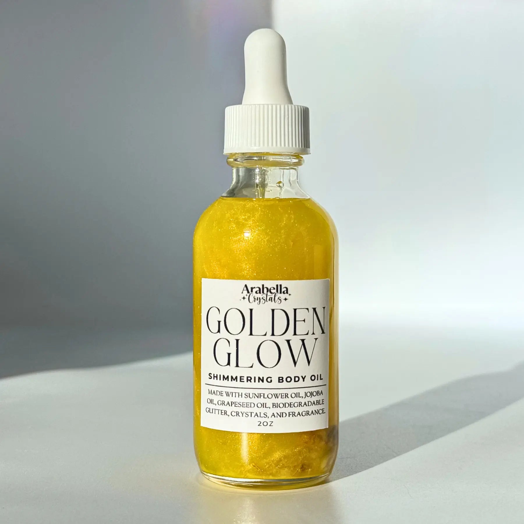 Golden Glow Shimmer Oil Notes of: Bergamot, Orange Blossom, Sandalwood