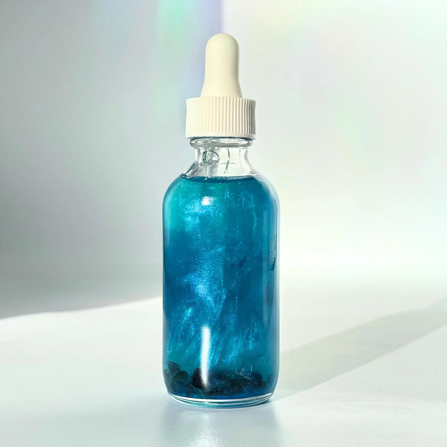 Evil Eye Shimmer Oil Notes of: Bergamot, Ylang Ylang, Amber, Musk