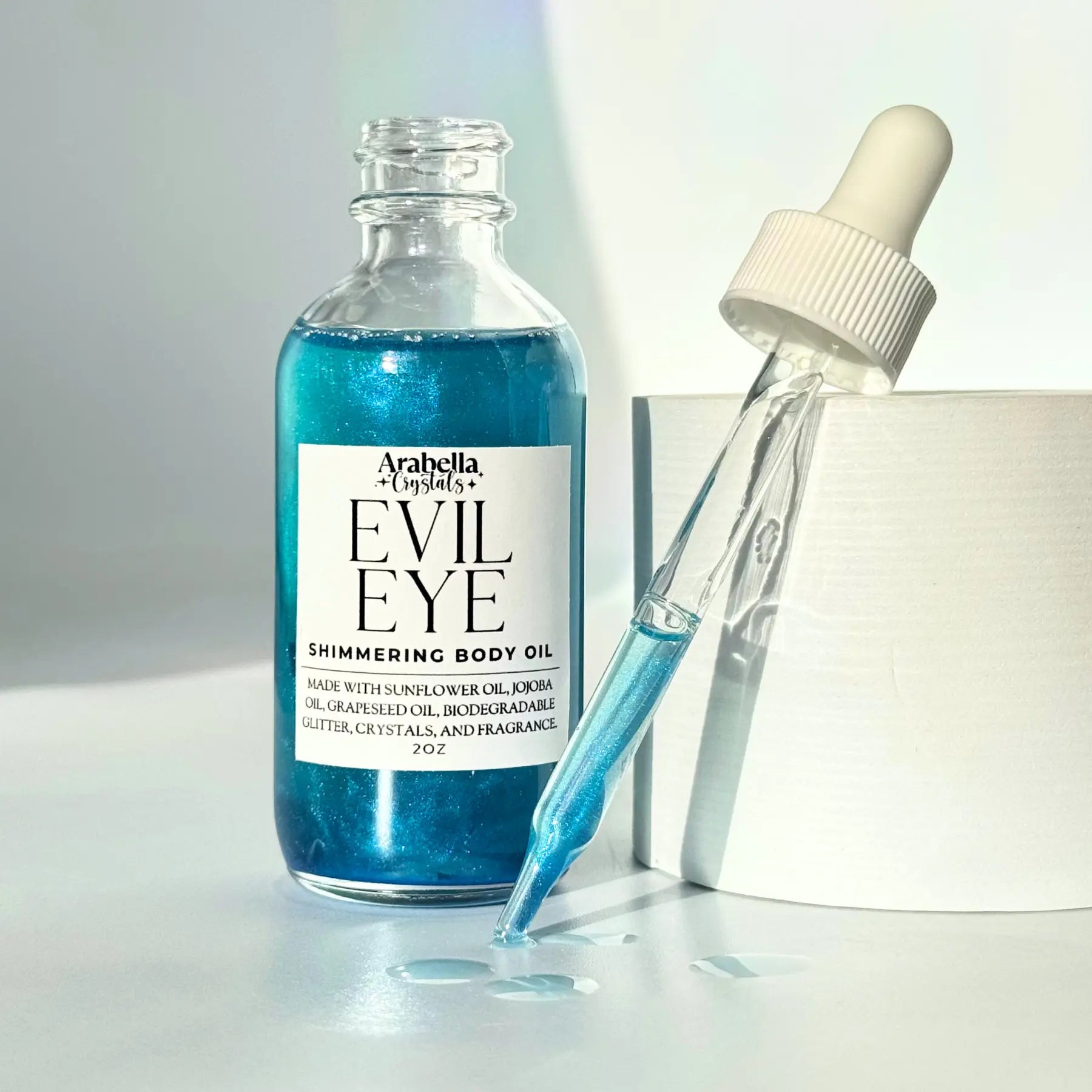 Evil Eye Shimmer Oil Notes of: Bergamot, Ylang Ylang, Amber, Musk
