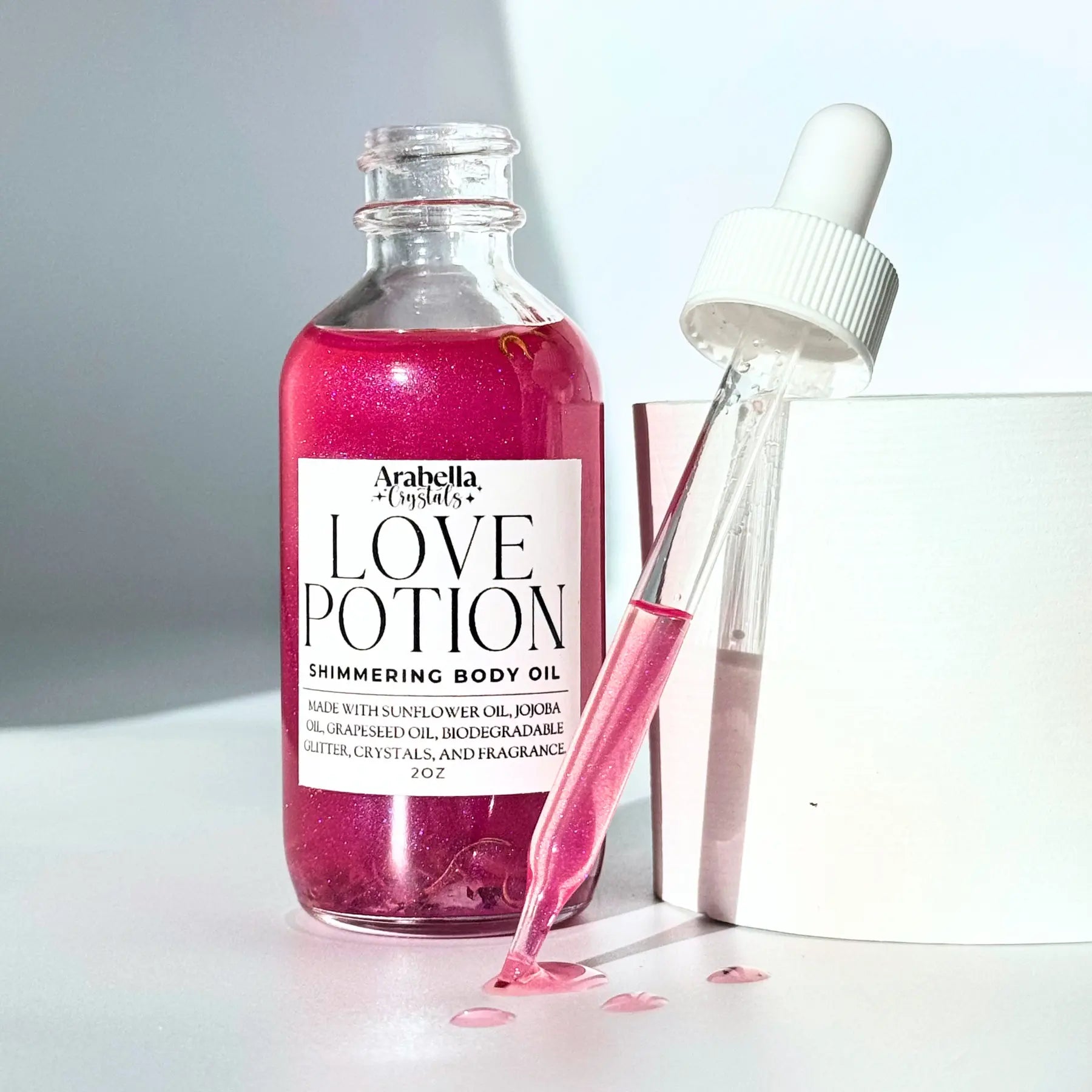 Love Potion Shimmer Oil Notes of: Plumeria, Jasmine, White Tea