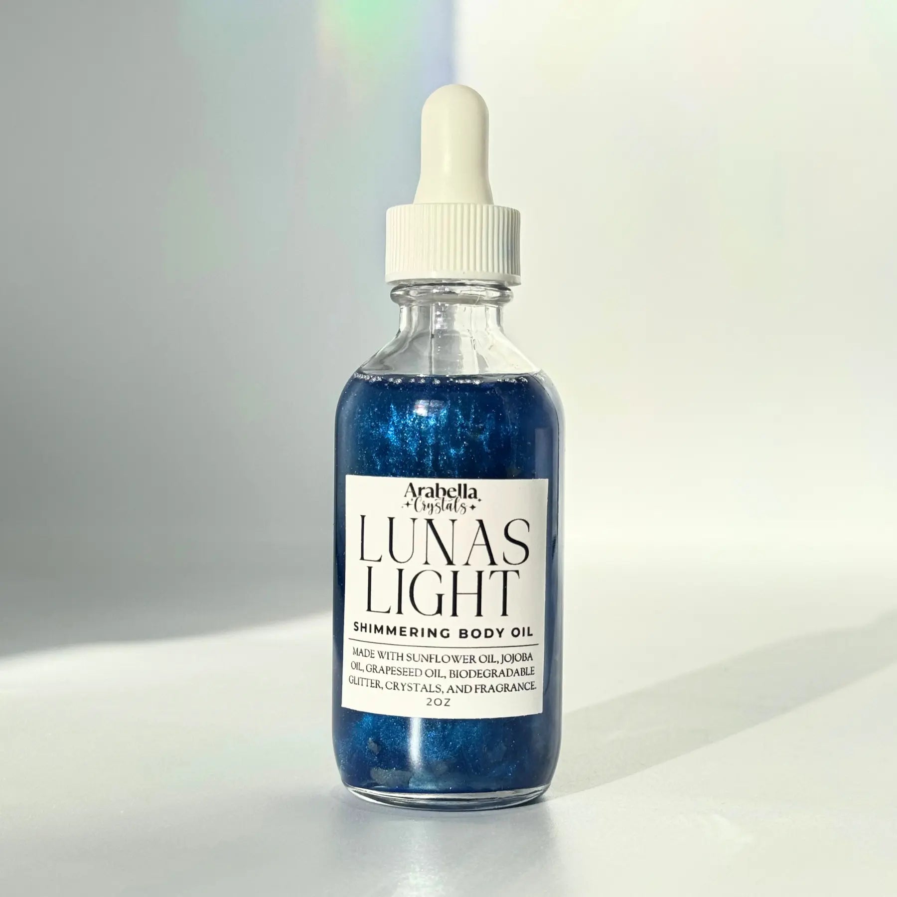 Lunas Light Shimmer Oil Notes of: Eucalyptus, Violet, Musk