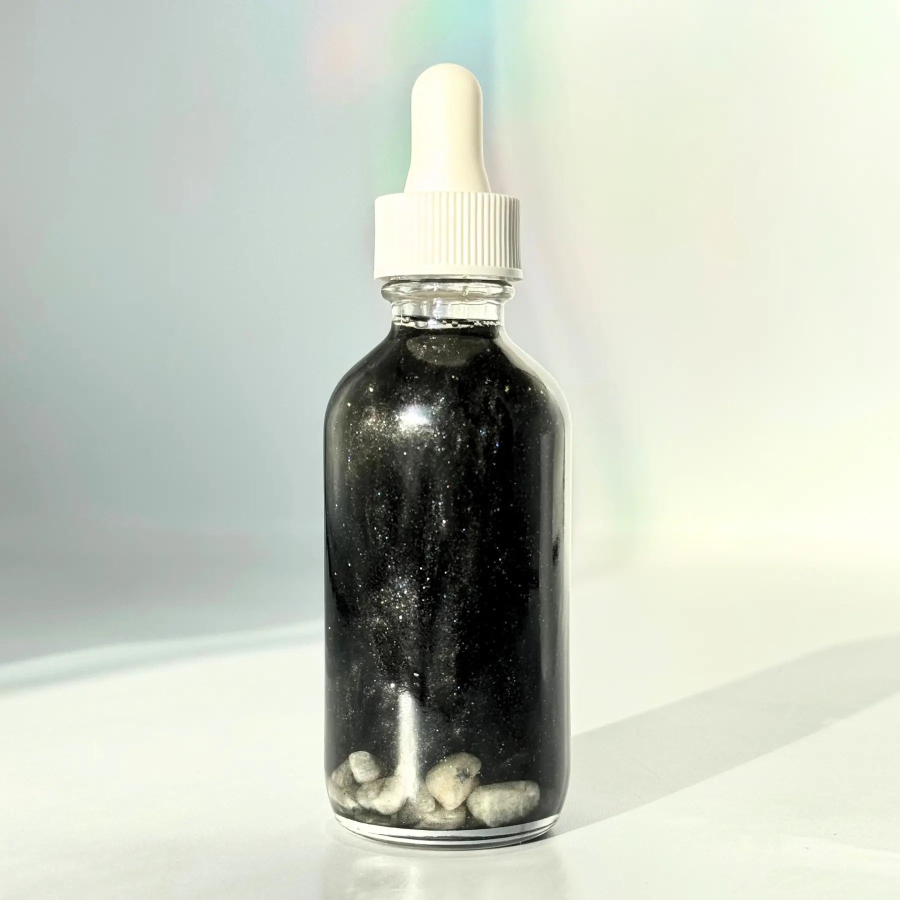 New Moon Shimmer Oil Notes of: Pear, Patchouli & Pine